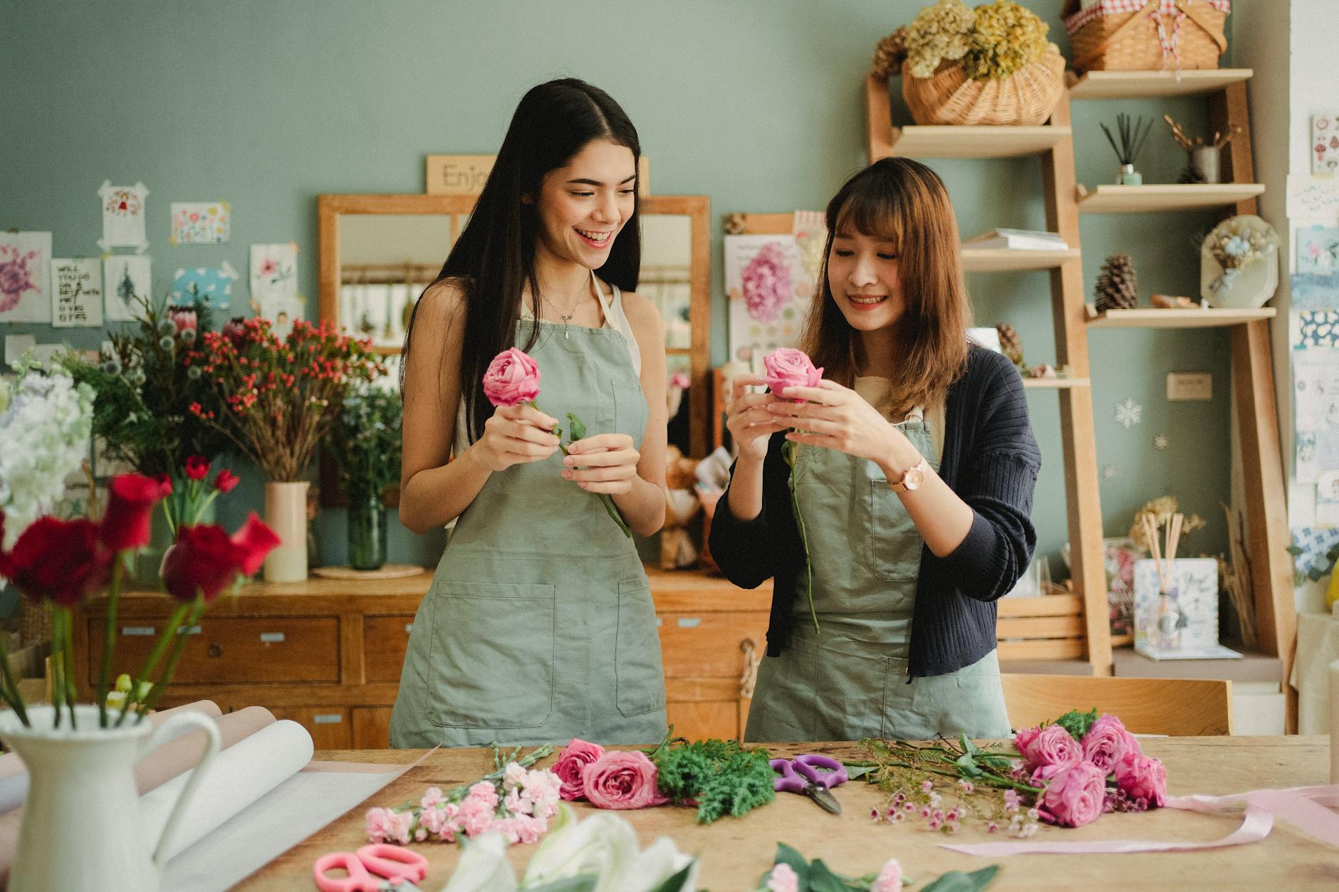 Florist creating a beautiful arrangement at Over Flowers